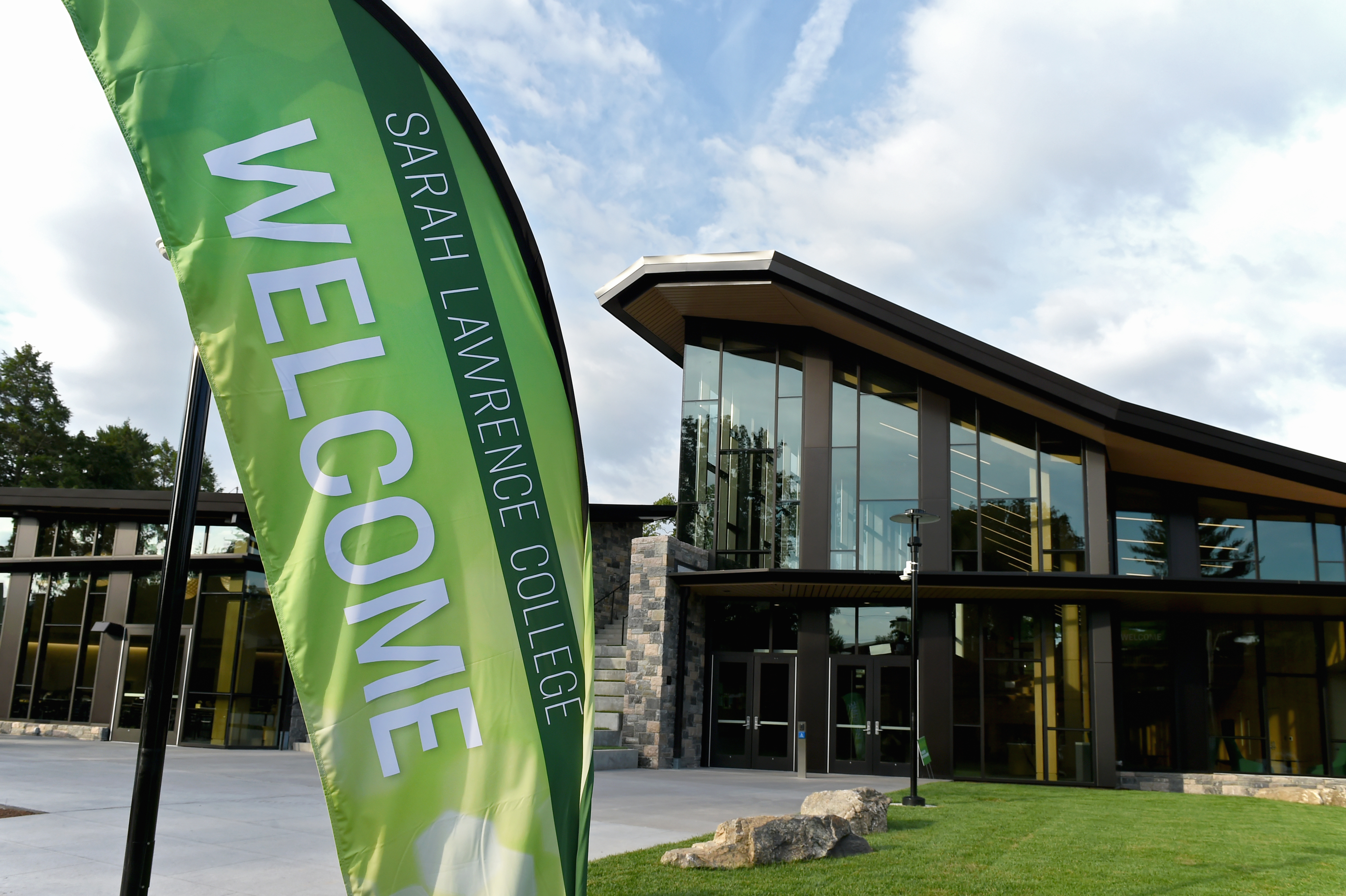 A banner saying welcome with the Barbara Walters Campus Center in the background