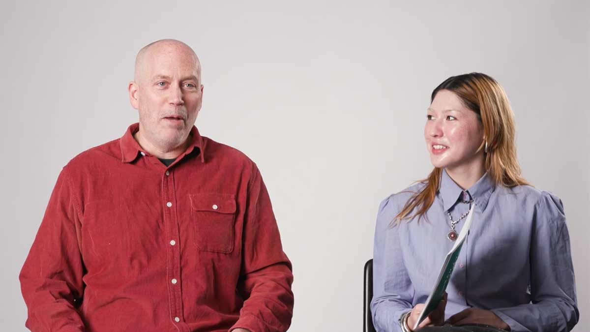 woman and a man sitting talking
