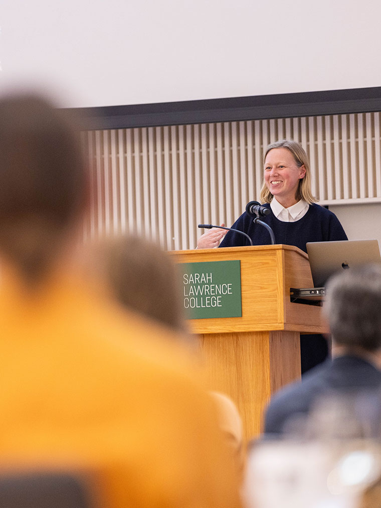 Sarah Hamill smiling at a podium