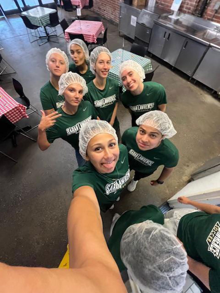 Selfie of women's soccer team members in a kitchen
