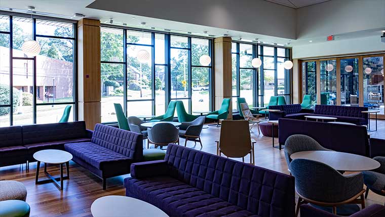 Campus center interior with couches and comfortable chairs