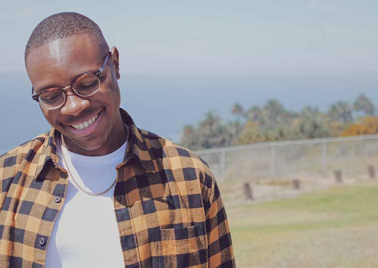 brandon childs standing outside looking downward