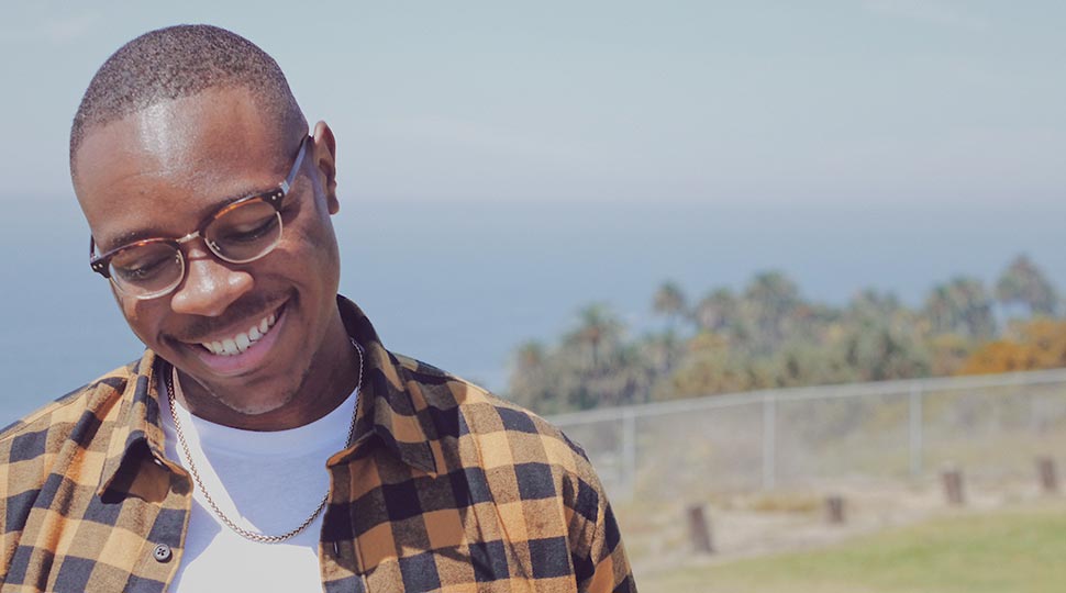 brandon childs standing outside looking downward