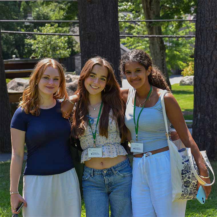 three students posing together