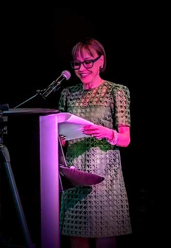 Eileen standing at a podium